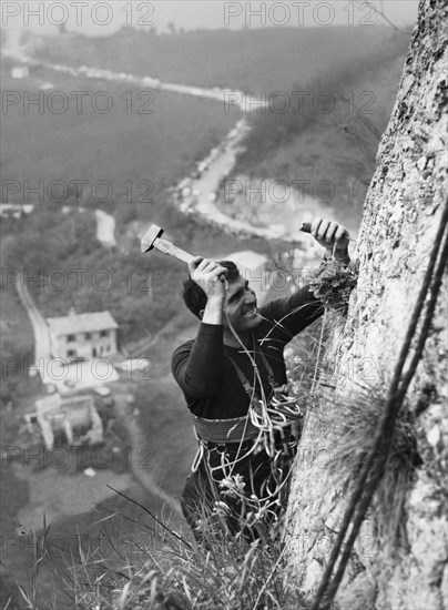 A climber plants the last nail.