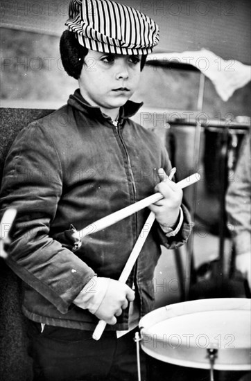 Student Holding His Drum Sticks.