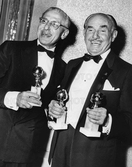 George Cukor and Jack L. Warner.