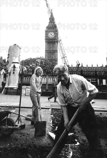 Workers in a road yard near big ben, london, uk, 70's