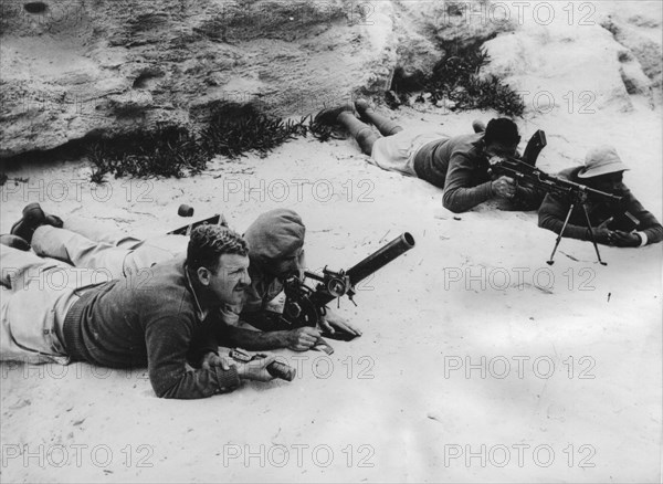 The Jewish army training in Tel Aviv in Palestine. This photo taken by a special correspondent from the New York Times shows Hagannah soldiers training in the handling of a 75 mm mortar and that of a machine gun.