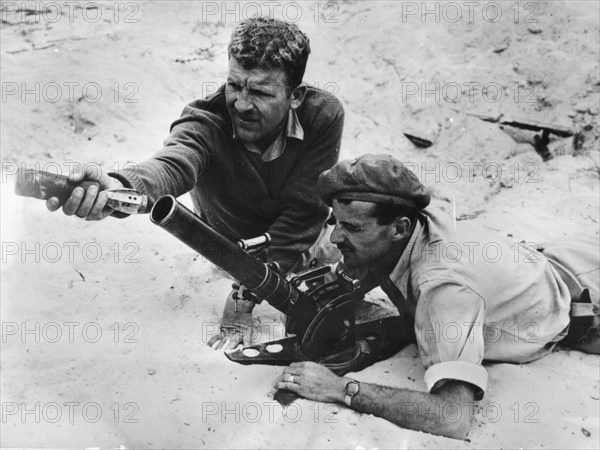 Jewish soldiers training on a 75mm mortar in Tel-Aviv.