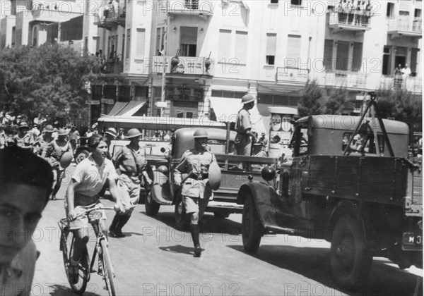 British police use weapons of clubs and shields to disperse demonstrators from an anti-Arab demonstration by Jews in Tel Aviv.