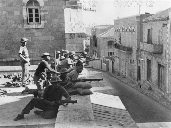 British troops on the roof of the French Hospital in Jerusalem, fighting against Arab rebels.