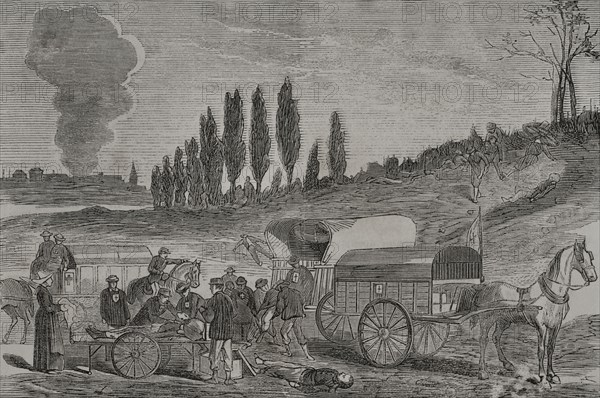 Franco-Prussian War (1870-1871). Burial of the dead by ambulances. Engraving. ""Historia de la Guerra de Francia y Prusia"" (History of the War between France and Prussia). Volume II. Published in Barcelona, 1871.