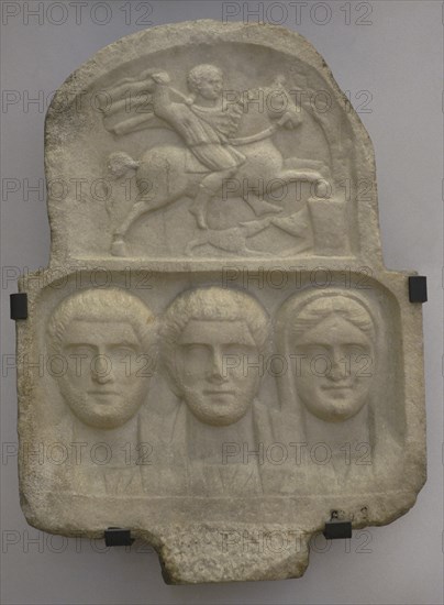 Family group: busts of two bearded men and a woman. Above: relief depicting Heros, the Thracian horseman. Stele. First half of the 3rd century AD. From Vranya, Blagoevgrad region, Bulgaria. National Archaeological Museum. Sofia. Bulgaria.