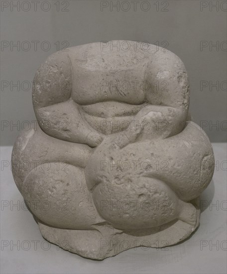 Headless sculpture of a seated human figure. From Hagar Qim, Malta. Temple Period (3600 BC to 2500 BC). National Museum of Archaeology. Valletta. Malta.