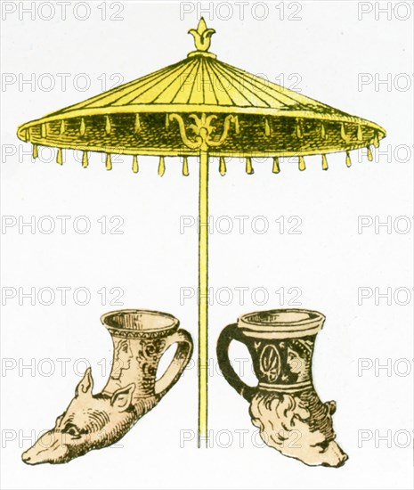 The illustration here shows ancient Greek artifacts. They are two rhytons and one parasol.The illustration dates to 1882.