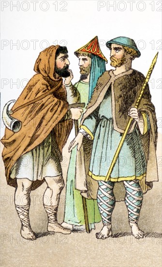 The figures represented here are Normans between A.D. 1000 and 1100. They are, from left to right: herdsman, man of rank, and a pilgrim. The Normans gave their name to the northwest region of France - Normandy. They were descendants of Viking conquerors of the area. The illustration dates to 1882.