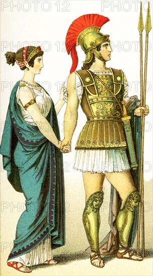 The figures represent two ancient Greeks: a woman of the upper class and her husband, a commander in chief. The illustration dates to 1882.