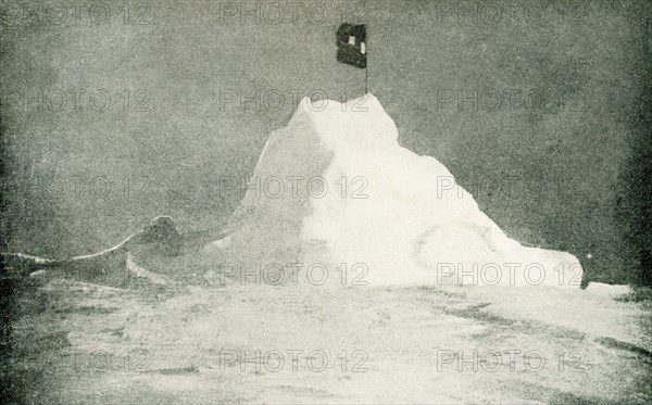 This photo shows Peary's flag flying at the north Pole, April 1909. By the courteous permission of Admiral Peary, from his book The North Pole, published by Messrs. Hodder & Stoughton. Peary was an American explorer and United States Navy officer who made several expeditions to the Arctic in the late 19th and early 20th centuries. He is best known for claiming to have reached the geographic North Pole with his expedition on April 6, 1909.