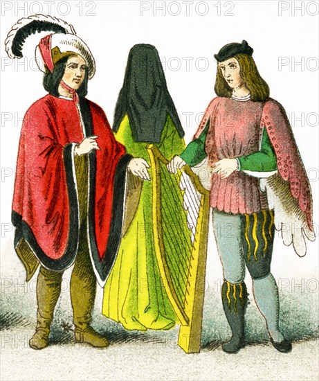 The image shows British costume between 1450 and 1500. The figures represent, from left to right: a male citizen, a female citizen, and a minstrel. The illustration dates to 1882.