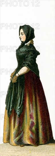 The figure pictured here is a German woman, a female citizen, in 1700. This illustration dates to 1882.