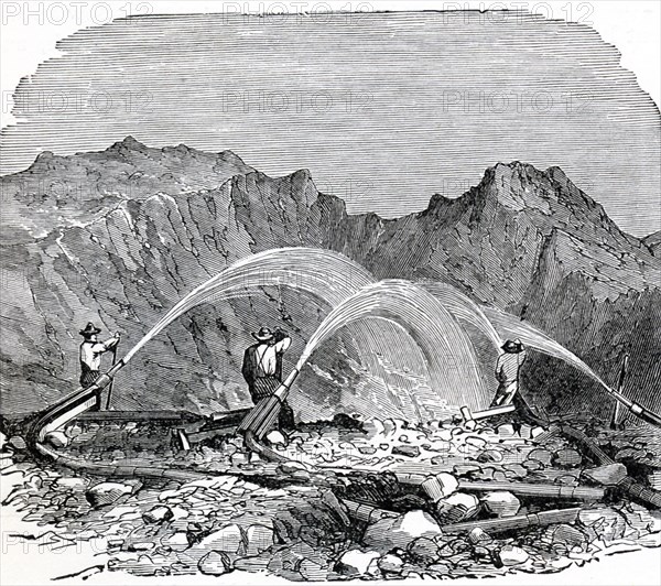 This 1896 illustration shows hydraulic mining being used by gold miners in the far West of the United States. Hydraulic mining is a form of mining that uses high-pressure jets of water to dislodge rock material or move sediment. The practice is an ancient one, but in modern times, it began to be used in the mid-1800s. Its environmental effect is very negative on lands that border rivers and streams. High-pressure water jets have also been used in the underground mining of coal, to break up the coal seam and wash the resulting coal slurry toward a collection point.