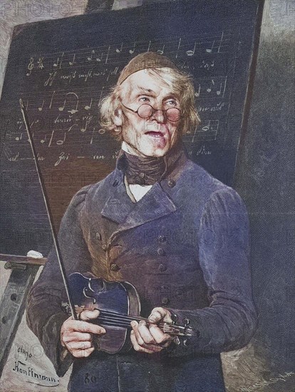 Old music teacher with violin standing in front of a table with sheet music.