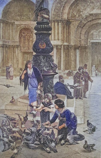 Children feeding pigeons in St Mark's Square in Venice.