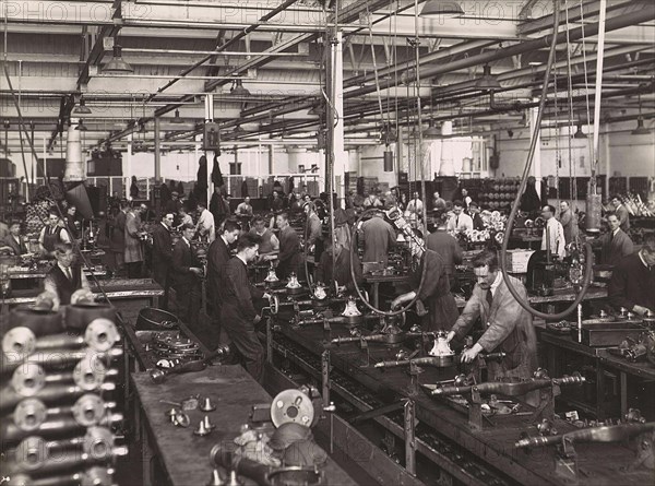 Wolseley factory interior with workers at machinery, Wolseley Motor Company was a British car manufacturer, Birmingham, 1932, England, Historic, digitally restored reproduction from a 19th century original.