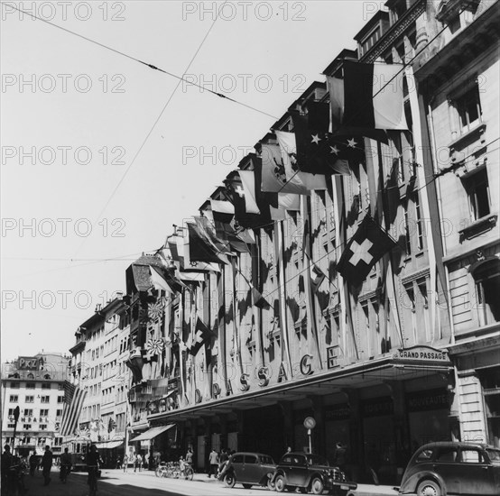 Frontage decorated with flags;  end of second world war; 1945.