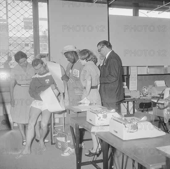 Olympic Games Rome 1960: Swiss athletes at press center.