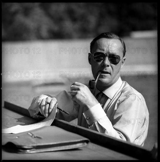 Prince Bernhard betting at horse races in St. Gallen.