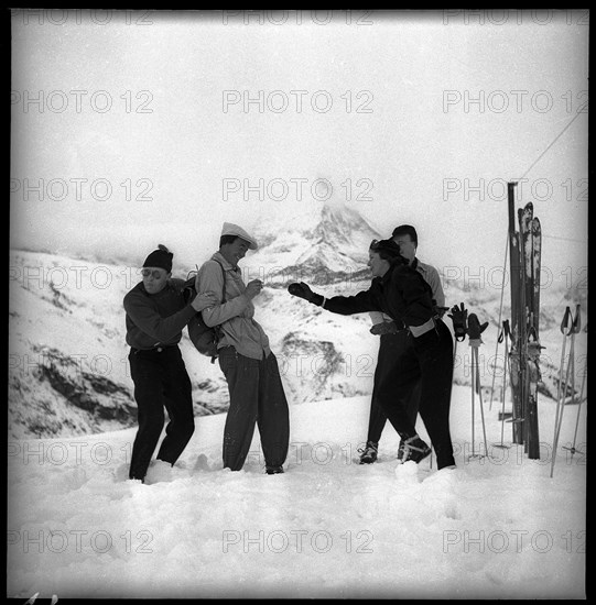 Prince Bernhard (l) takes cover during a snowball fight, 1947.