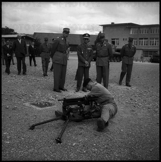 King Bhumibol of Thailand (c) visiting soldiers in Thun, 1960.