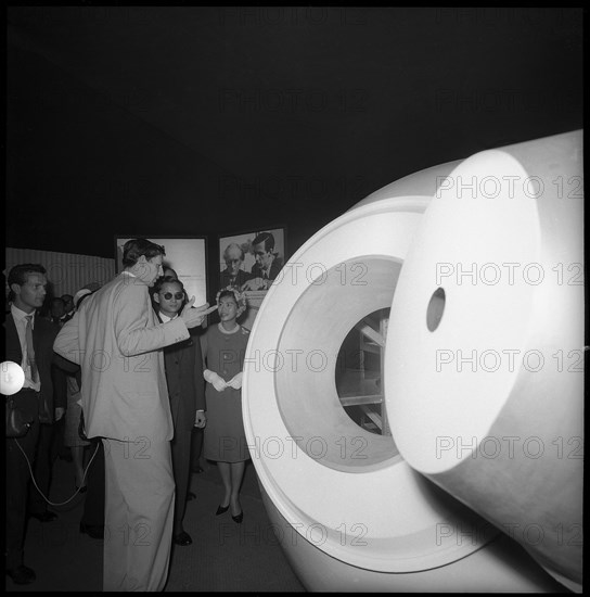 Jacques Piccard next to his submarine Bathyskaph, with Bhumibol and Sirikit of Thailand, 1960.