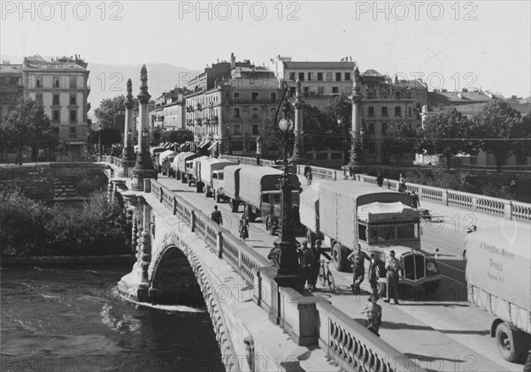 Swiss trucks travelling in convoy leaving Geneva; 1941.