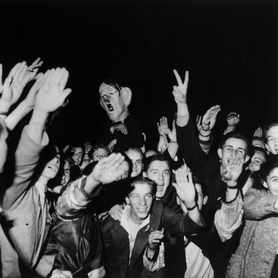 Young people celebrating end of second world war; 1945.