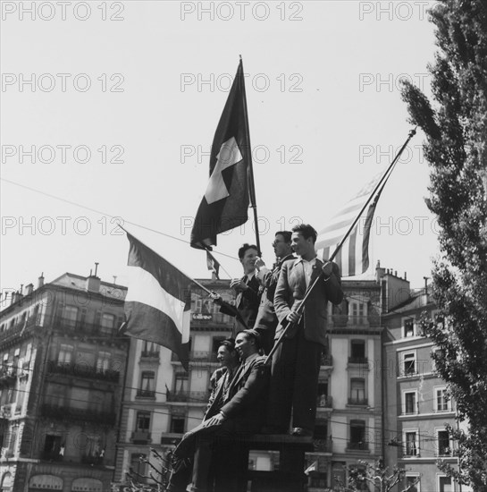 Young men celebrating the end of second world war; 1945 .