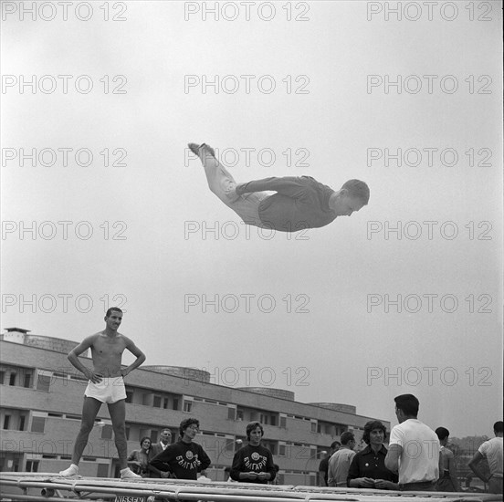 Rome 1960: trampoline training outdoors.