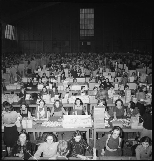 Women preparing parcels, christmas present for soldiers. 1940