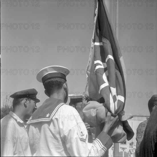 Rome 1960: sailors flying the olympic flag.