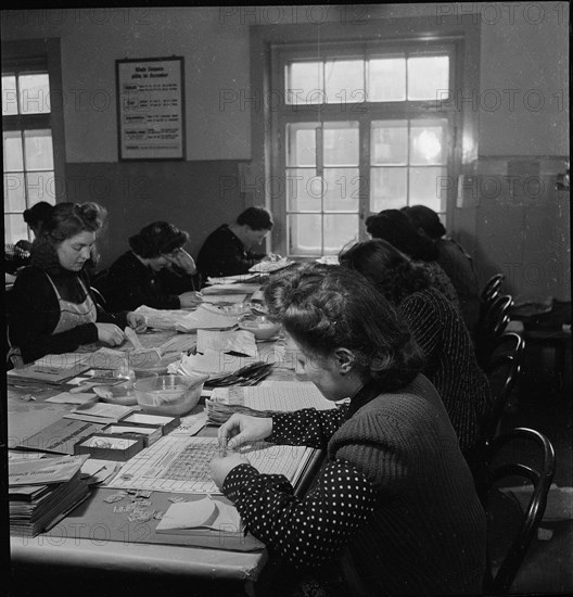 Public administration of food ration cards, coupons, around 1945.