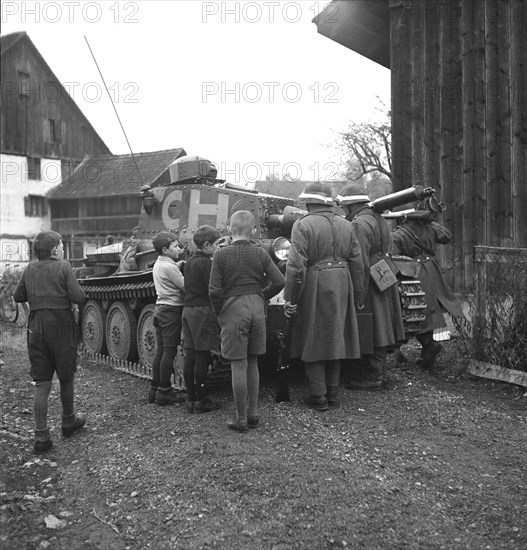 Children admiring tank. Zurich Oberland 1943