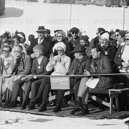 Grace and Rainier as spectators at Swiss ski championship in Gstaad, 1962.