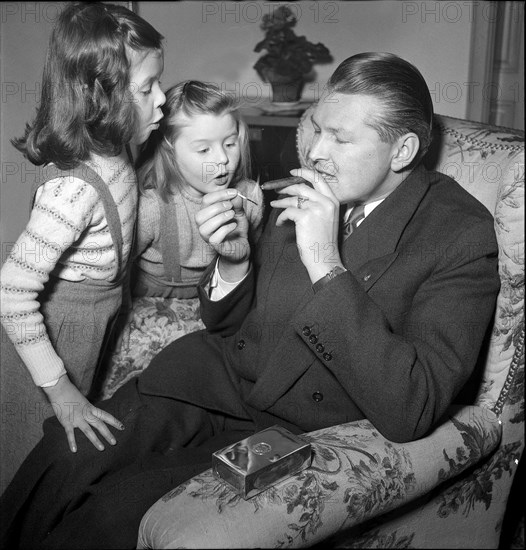 Willy P. Daetwyler, at home with family around 1957.