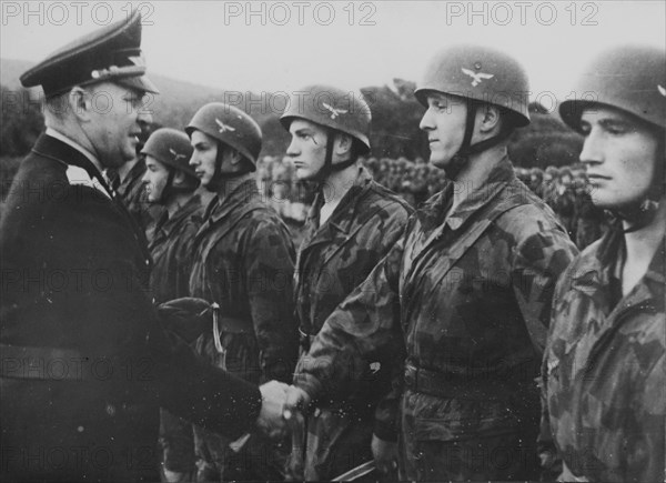 WW 2 Italy: General Student give the soldiers of the parachute troops the Iron Cross.