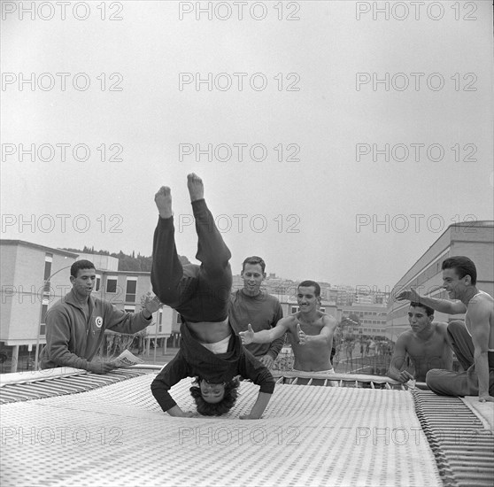 Rome 1960: trampoline training outdoors.