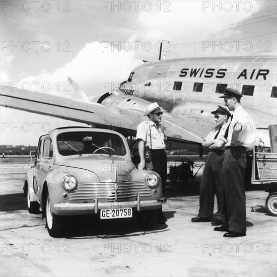 Renault in front of a Swissair aircraft, Geneva airport, around 1950.