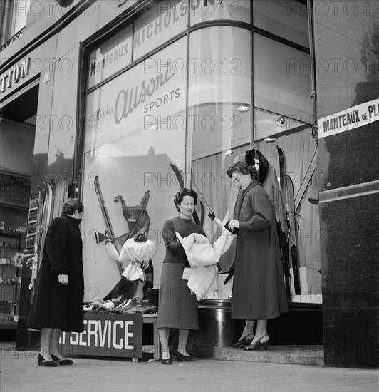 Skier Olivia Ausoni manages her sporting goods store in Lausanne ca. 1955.