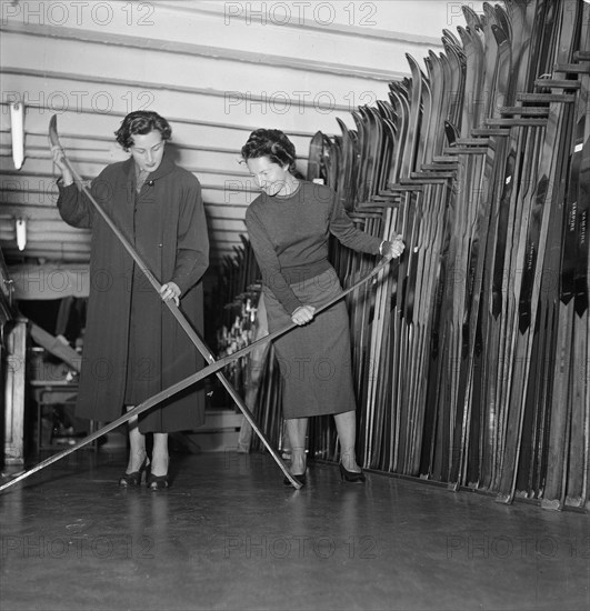 Skier Olivia Ausoni manages her sporting goods store in Lausanne ca. 1955.