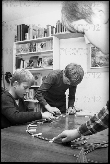 Children playing with a model railway, 1967.