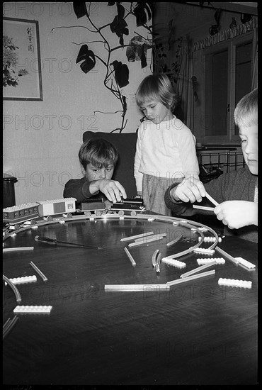 Children playing with a model railway, 1967.