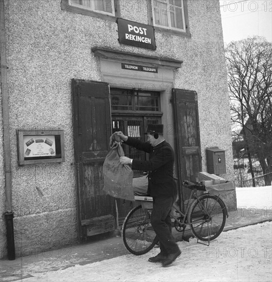 Postman at the post office in Rekingen AG 1950.