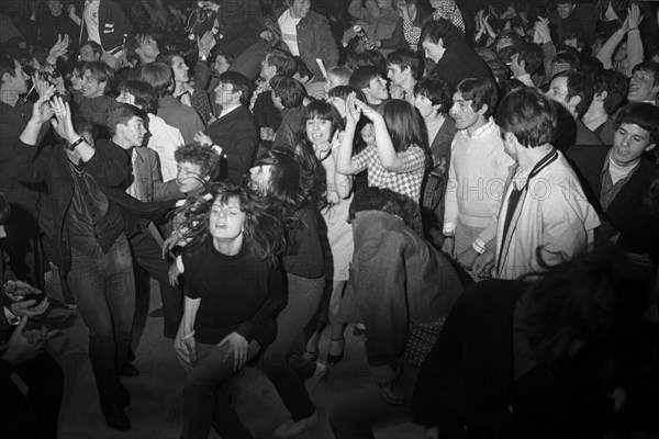 Cheering fans at Rolling Stones concert at Hallenstadion, Zurich 1967 .