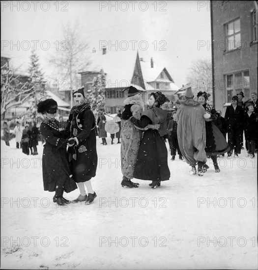 Dancing in the snow on carnival festivities circa in 1950