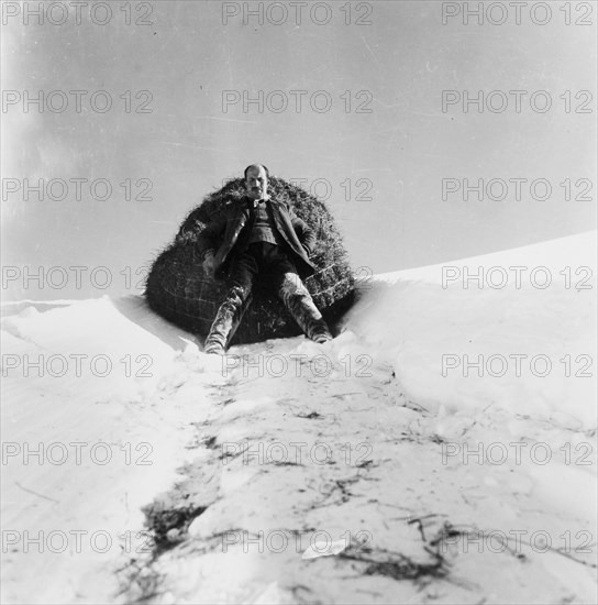 Mountain farmer pulling hay down into the valley, around 1960