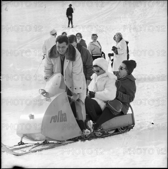 Princess Marina, Duchess of Kent (C) on a snowmobile