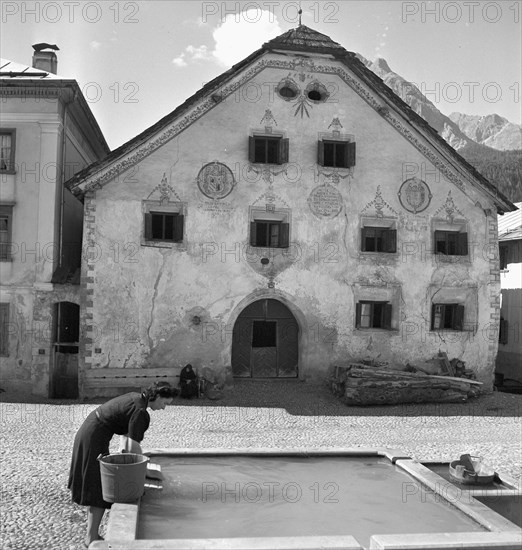 Fountain at village square in Scuol GR